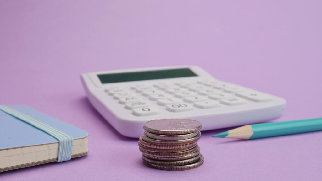 close up shot of stacked coins on a purple background